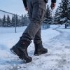 JHB10 Heated Winter Work Boots - Winter Patrol Scene Site patrol officer walking a snowy perimeter in JHB10 heated winter work boots