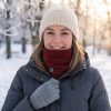 JHN02 Heated Neck Warmer – Snow Outdoor Woman wearing JHN02 heated neck warmer with knit beanie and grey gloves in snowy outdoor scene